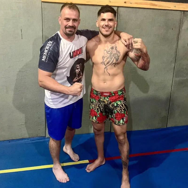Kevem with a friend on the mats after training