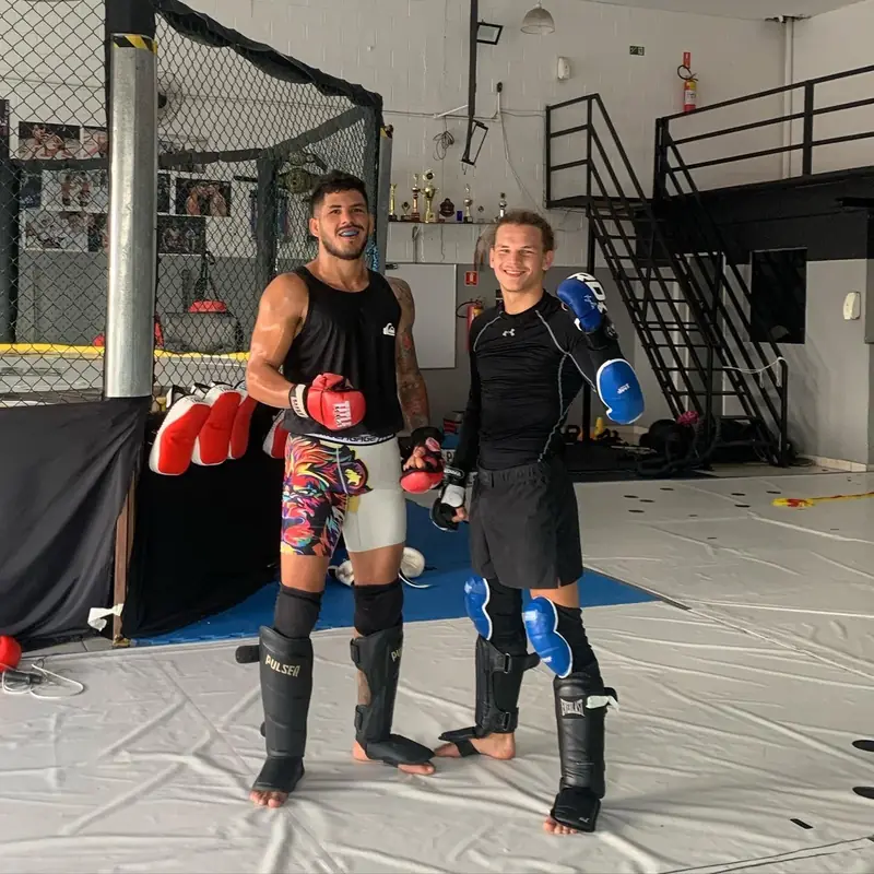Kevem and a partner in shin guards before Muay Thai training