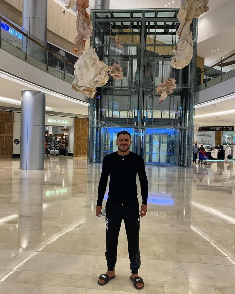 Kevem travelling, in a shopping-mall lobby