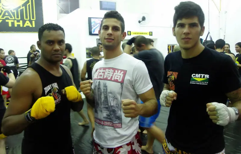 Kevem with friends at a Muay Thai gym