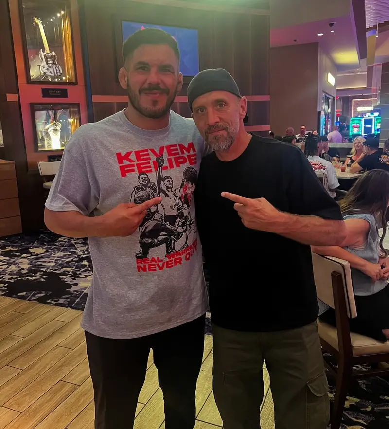 Kevem with a friend wearing a shirt with his name
