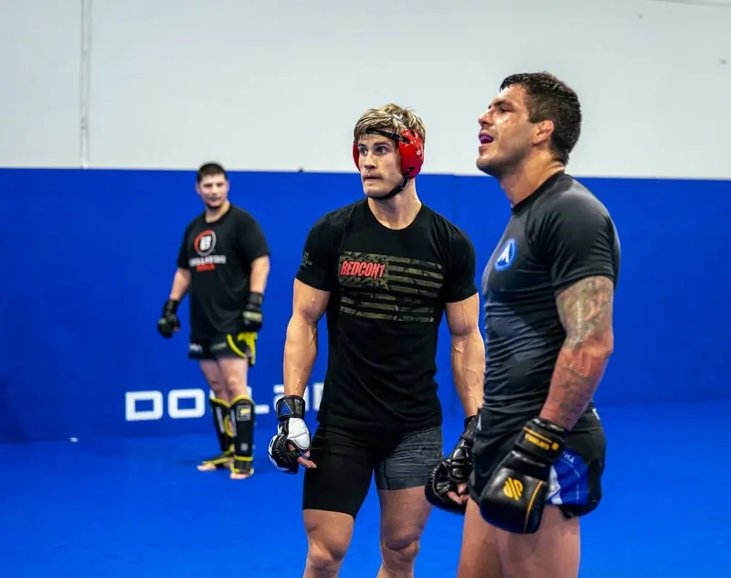 Kevem talks with a partner during training
