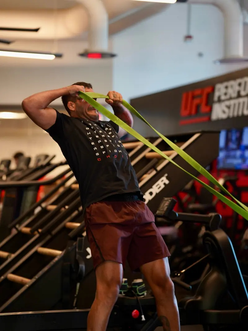 Kevem trains with a resistance band at the UFC Performance Institute