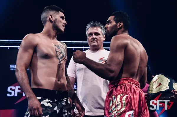 Kevem and his opponent with the referee at SFT