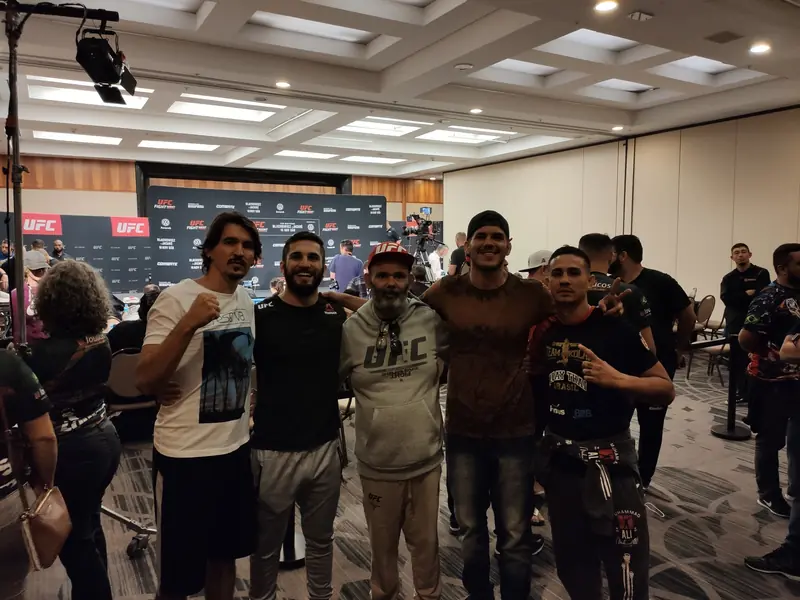 Kevem with friends backstage at a UFC event