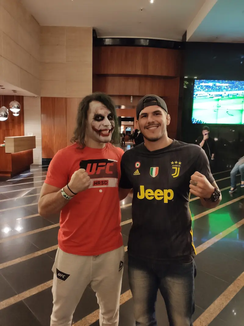 Kevem with a fan dressed as the Joker