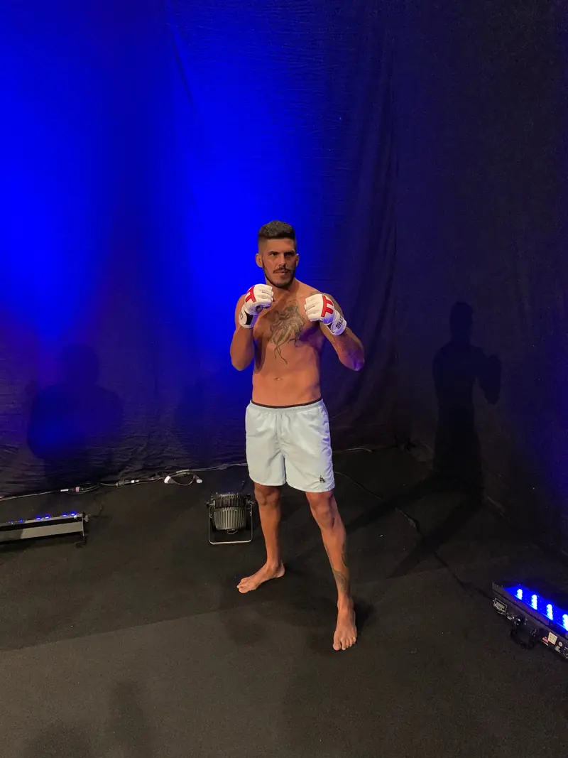Kevem against the blue backdrop of the pre-fight shoot