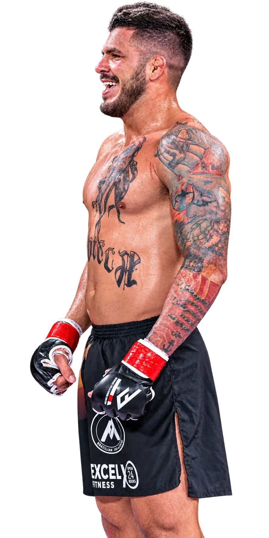 Kevem smiling in the cage, shirtless and gloved, his tattoos showing